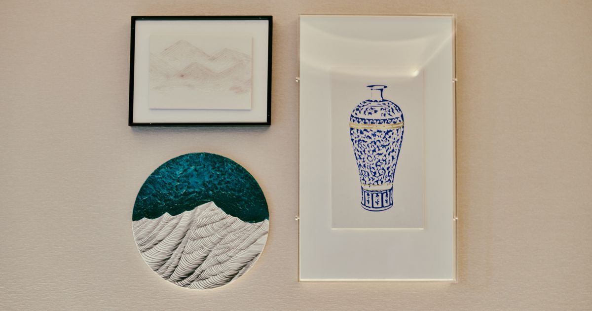 A collection of framed minimalist art on a textured wall, perfect for home decor.