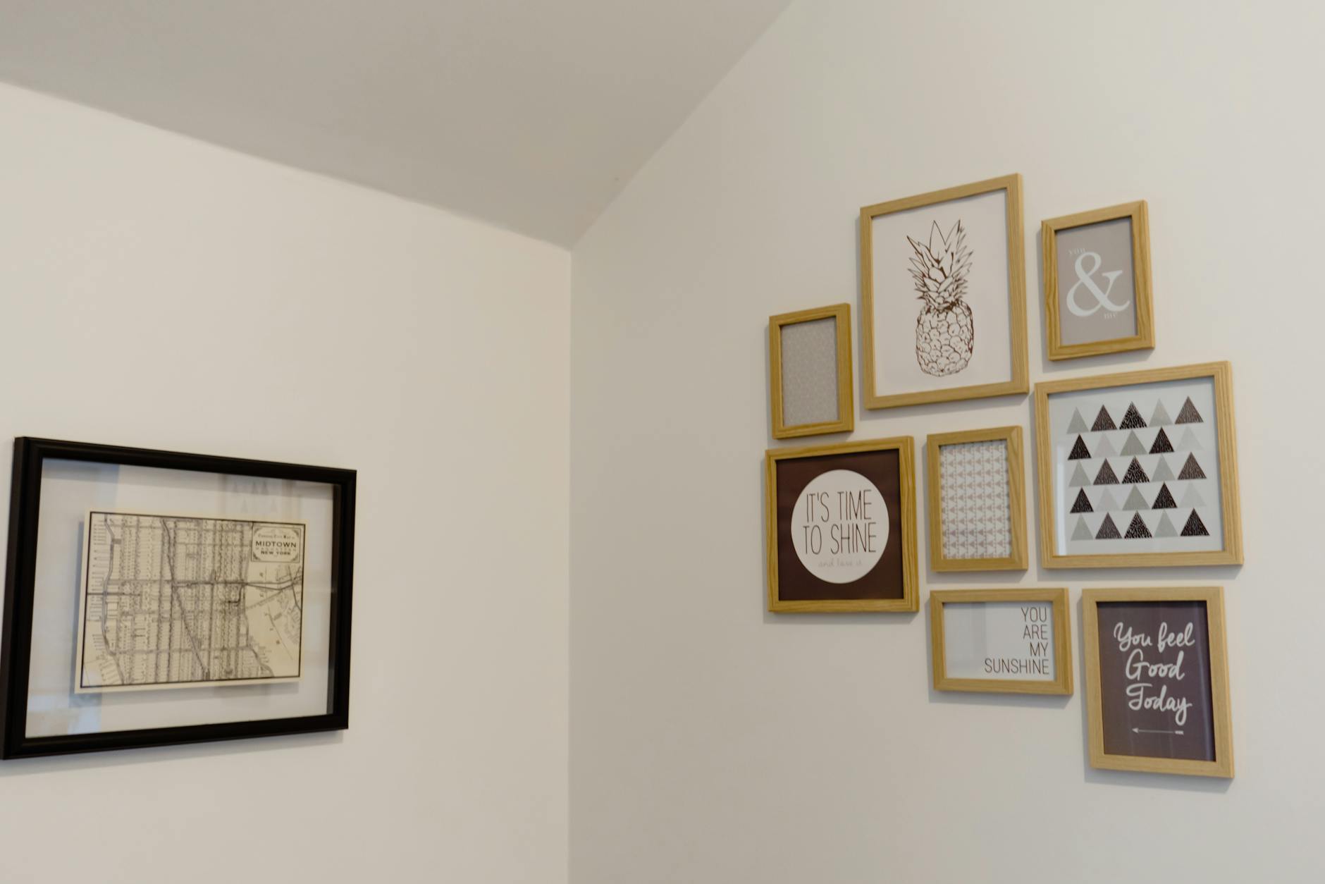 Chic arrangement of picture frames on a neutral white wall, styled gallery wall