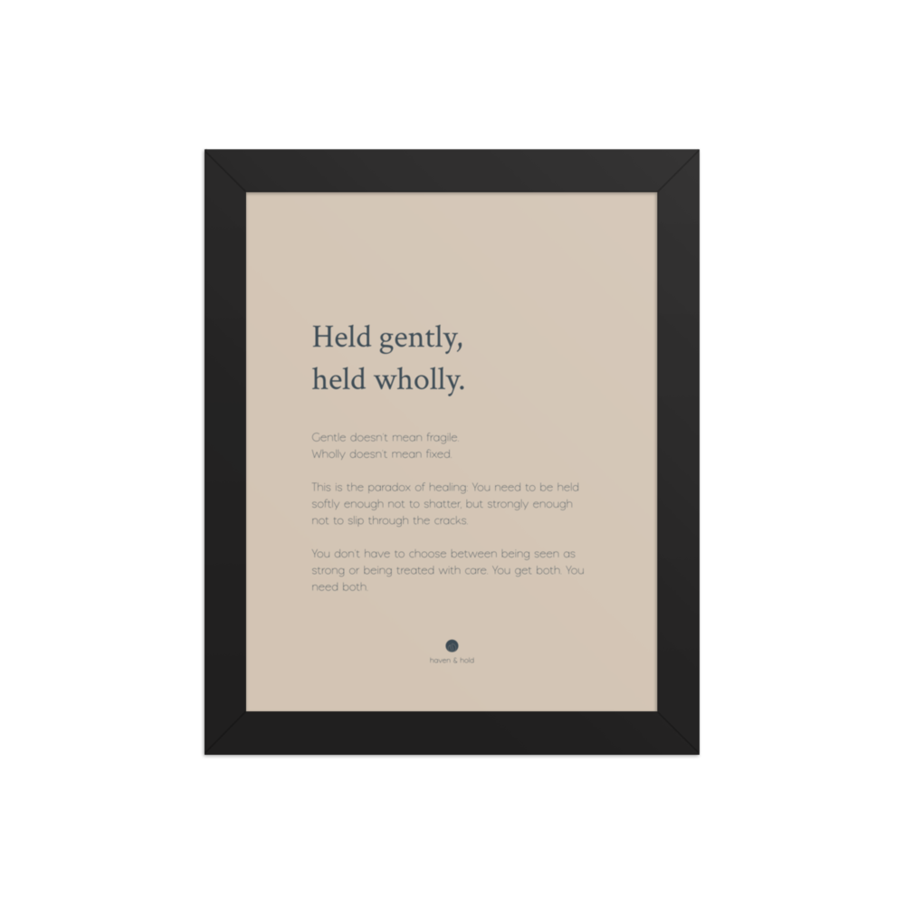 Held Gently Held Wholly framed wall art print in black frame, studio product view