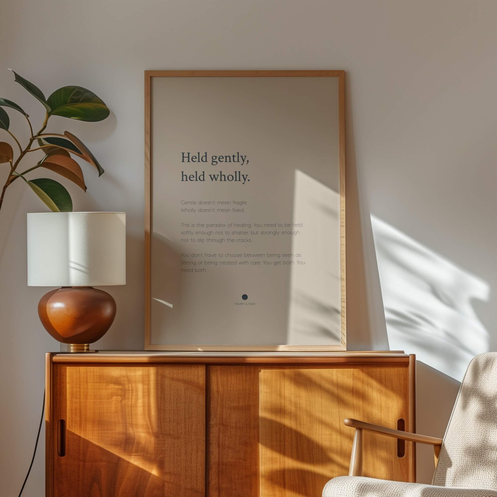 Held Gently Held Wholly framed wall art print in black frame