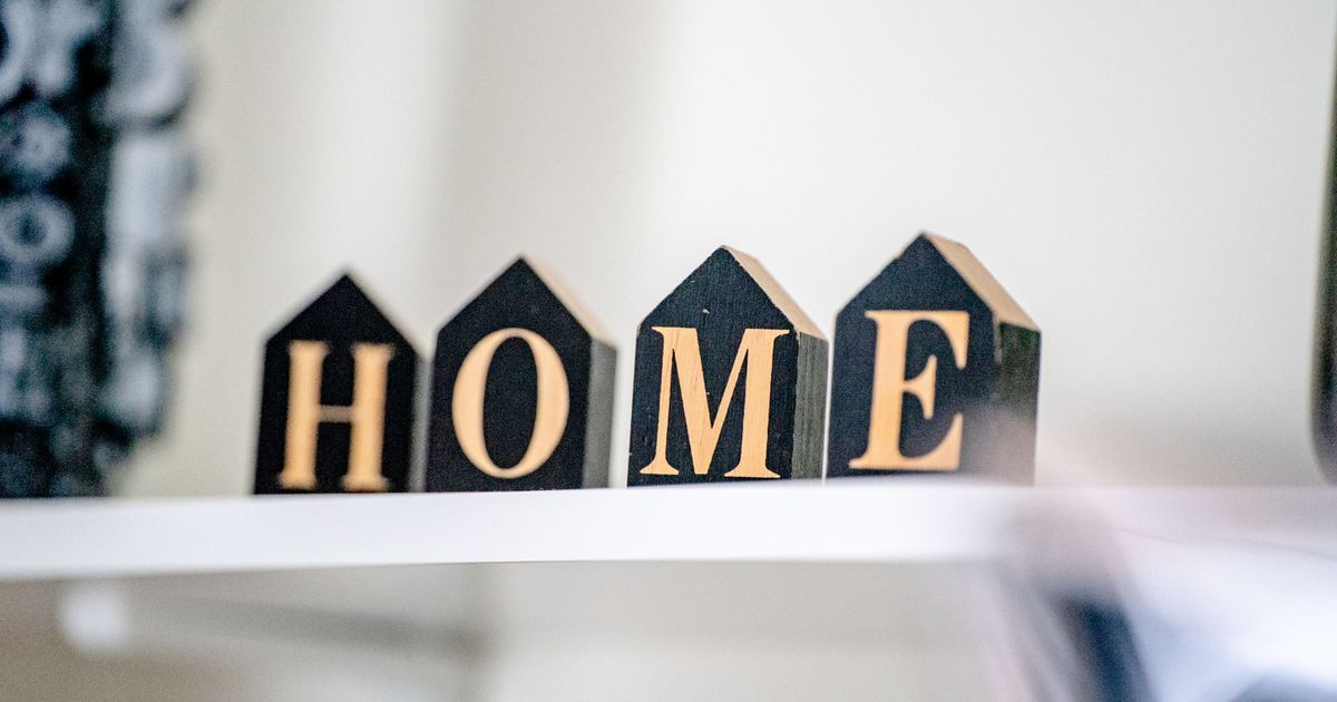 Stylish wooden block letters spelling "HOME" for cozy home decor.