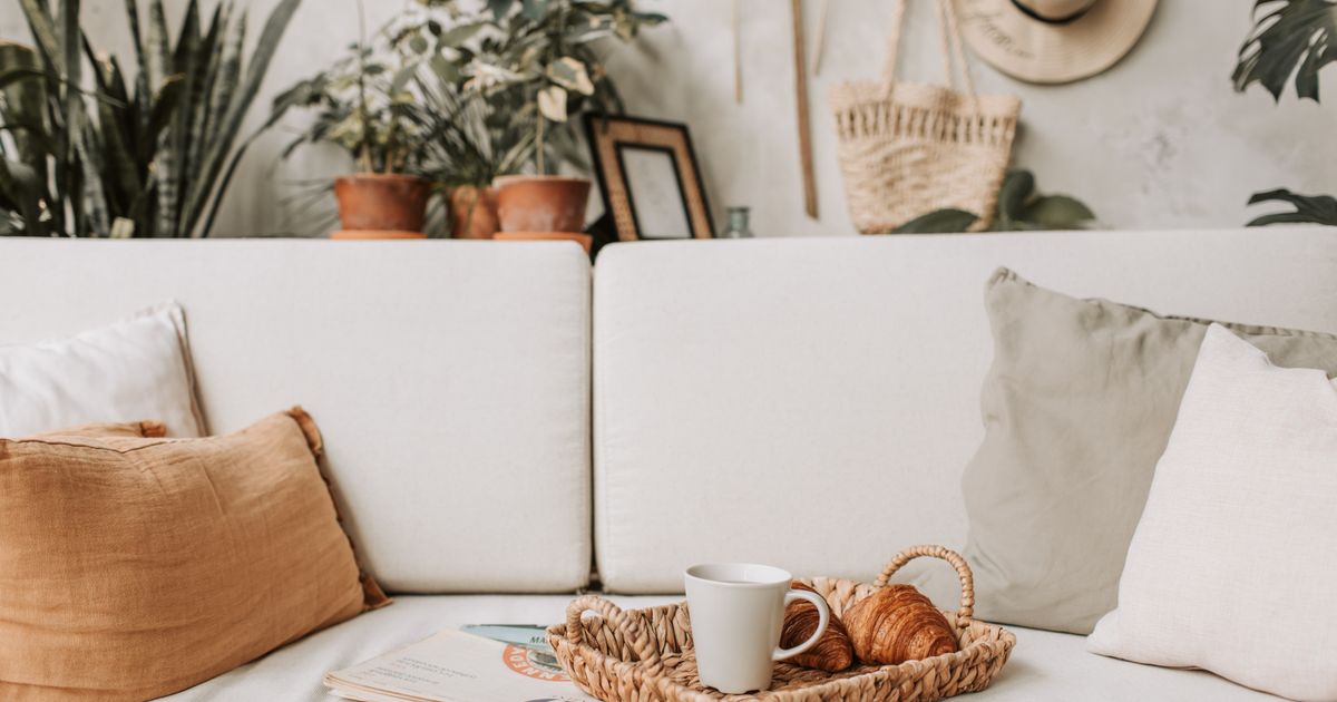 Cozy living room scene with coffee and croissants. Ideal for lifestyle and home decor concepts.