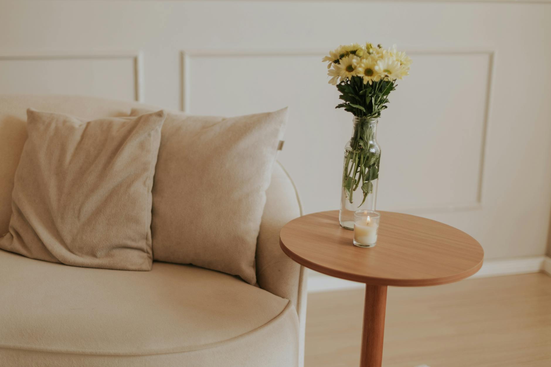 A peaceful minimalist interior with warm neutral tones and soft light, evoking calm and groundedness.