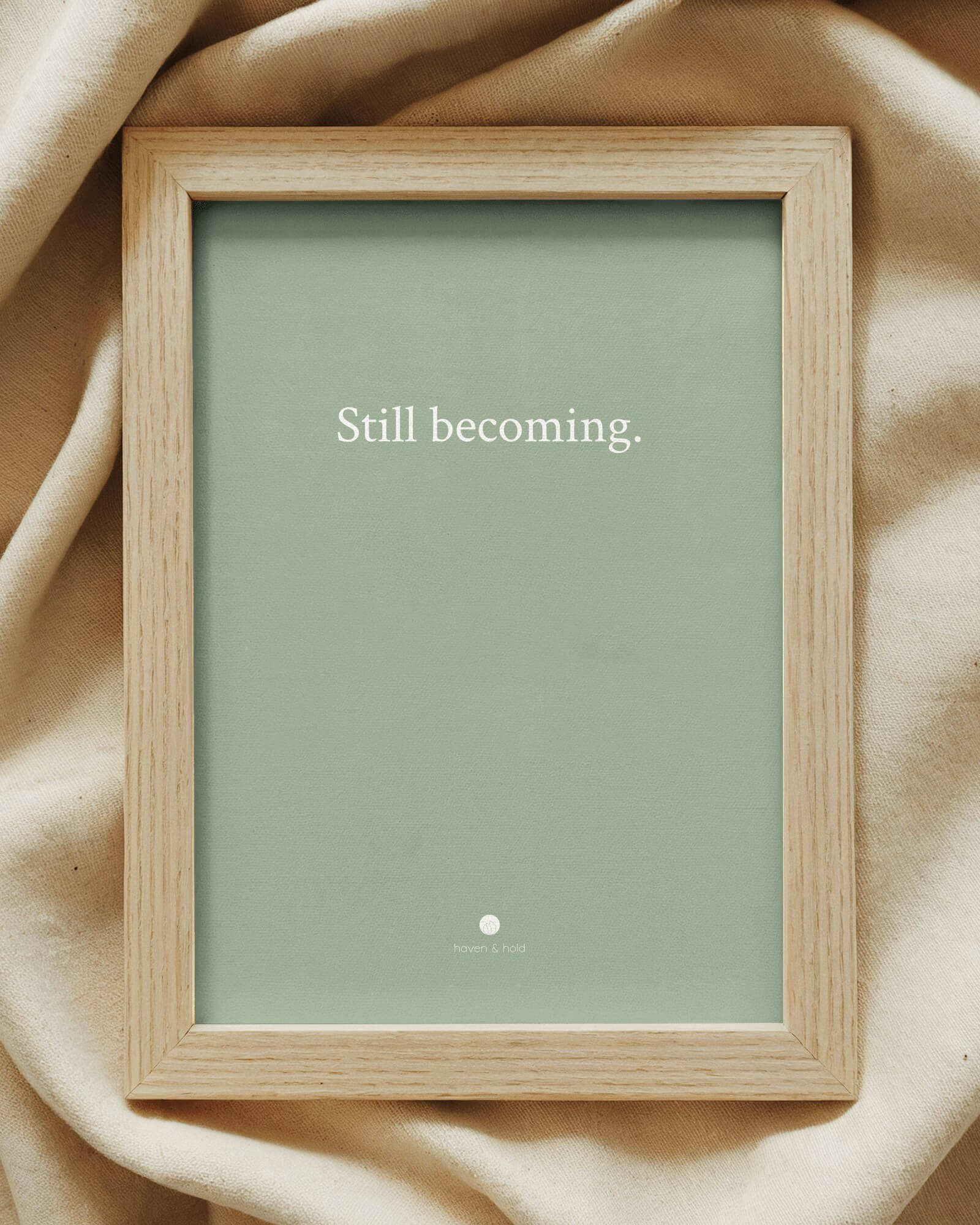 Still Becoming framed typography print on shelf display